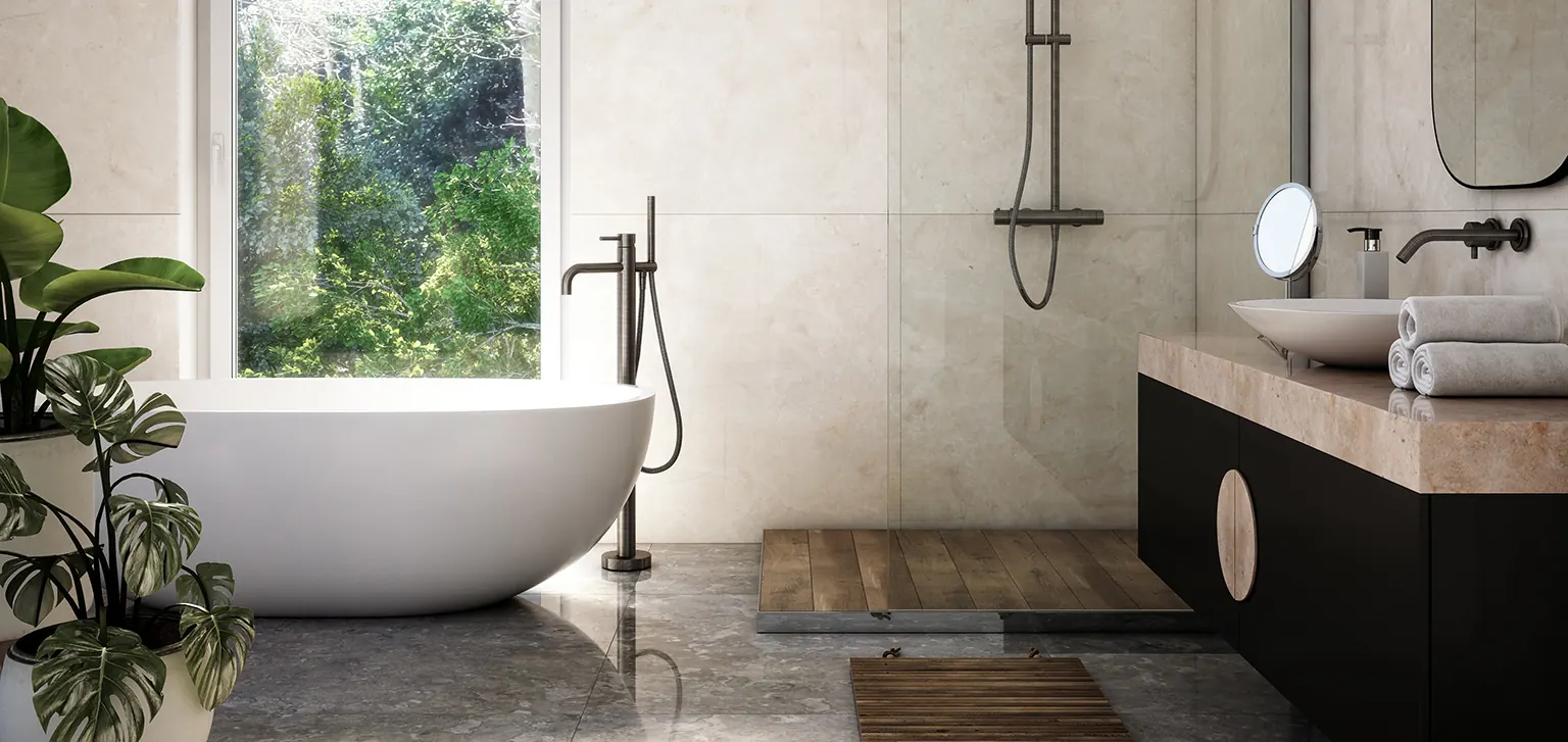 Bright bathroom with a freestanding bath, large-format tiles and garden views