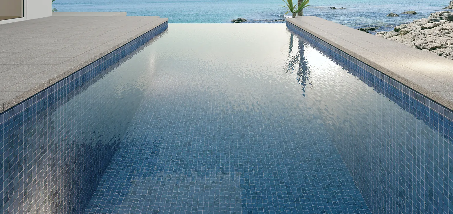 Infinity pool finished in blue mosaic tiles